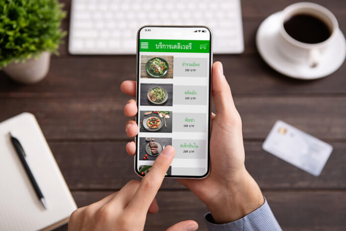 Food,Delivery.,Businessman,Choosing,Meal,For,Lunch,In,Takeaway,Restaurant
