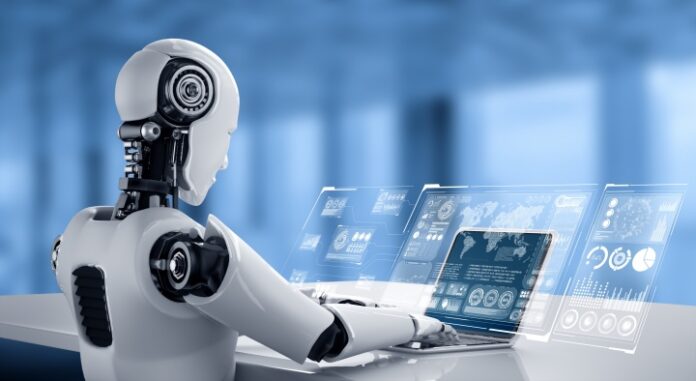 Robot humanoid use laptop and sit at table for big data analytic